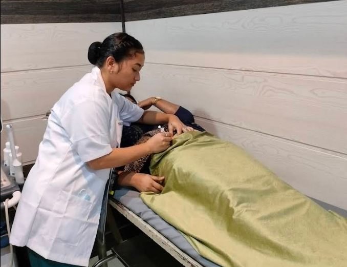 Doctor performing an ultrasound scan for an expectant mother