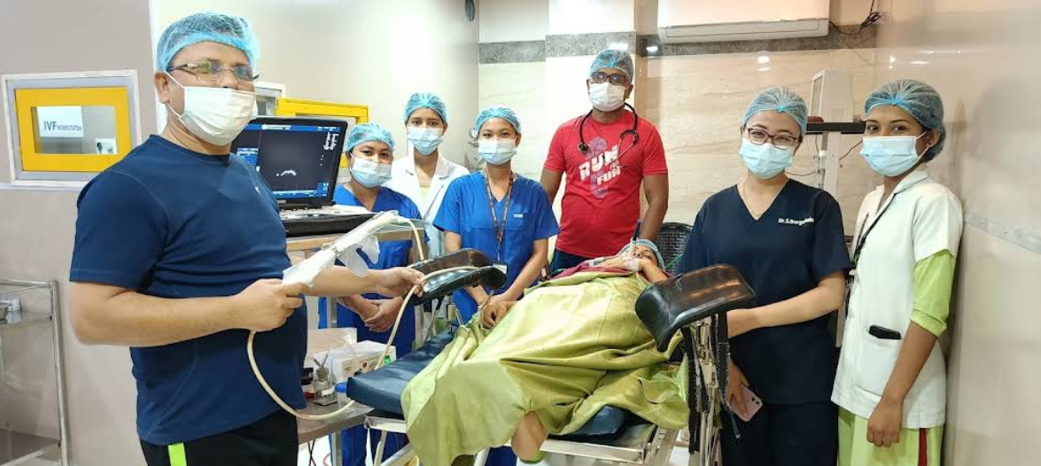 IVF laboratory with embryologist examining samples under microscope